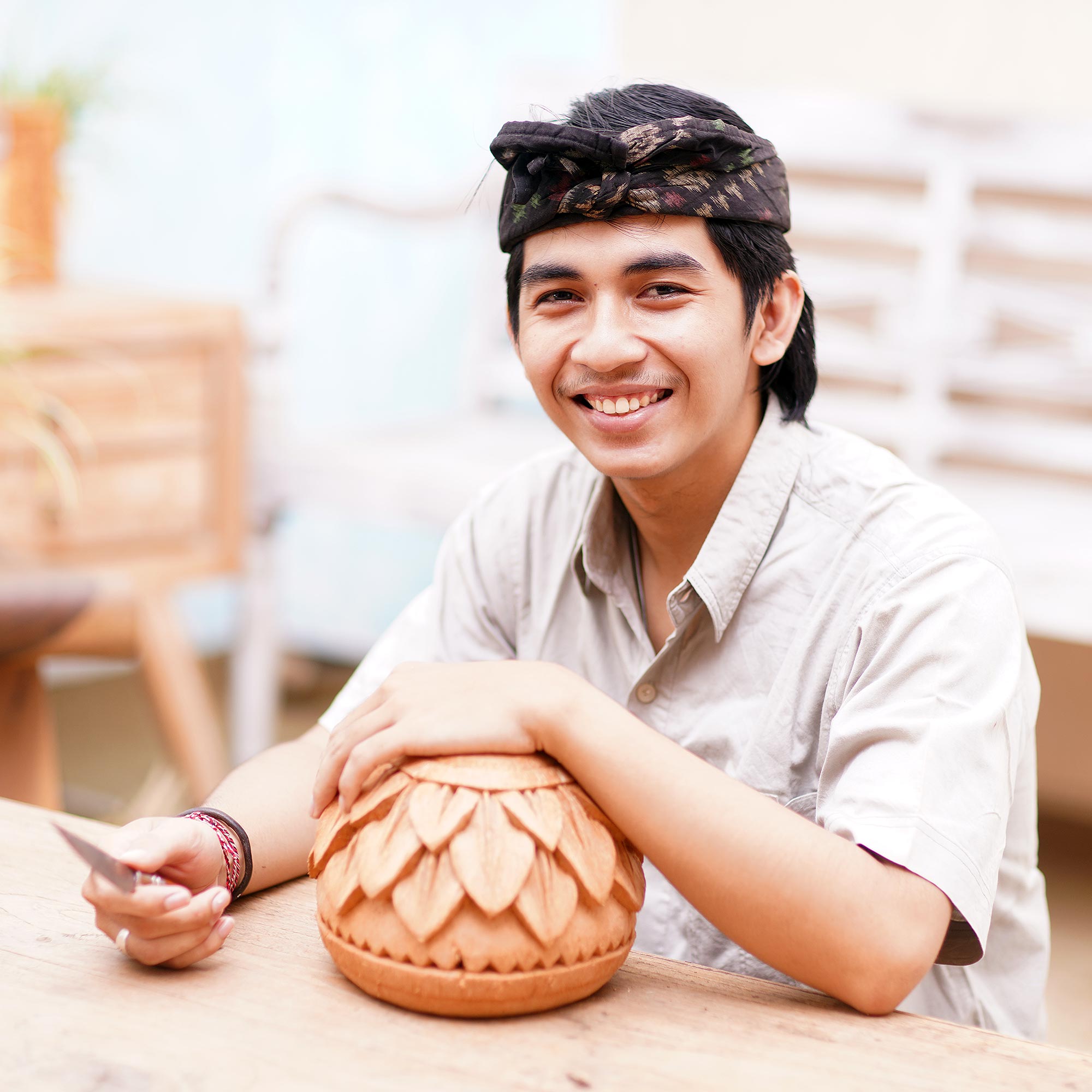 Handcrafted Coconut Shell Hanging Planter from Bali - Tropical House in Turtle